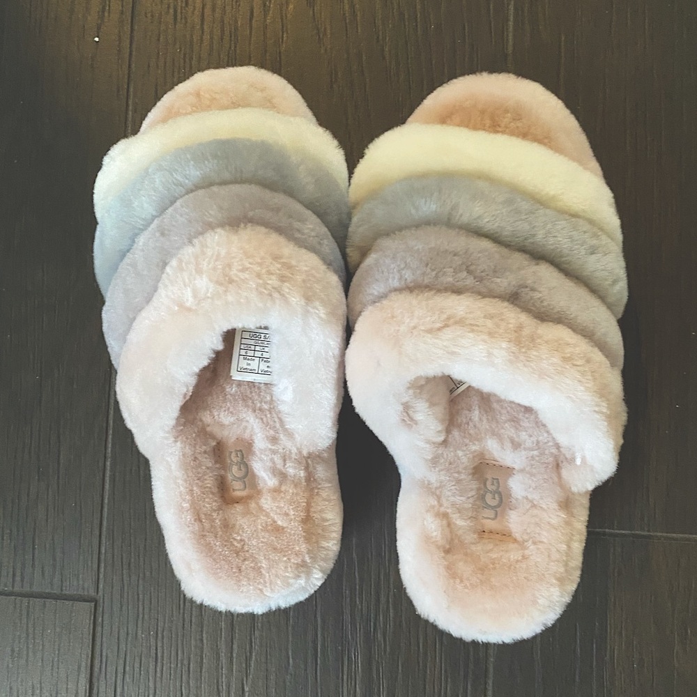 UGG fluffy slippers. Pink with pink, purple, grey and white across top size 6